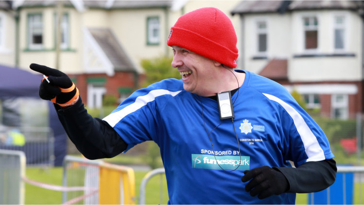 Smiling man in red hat