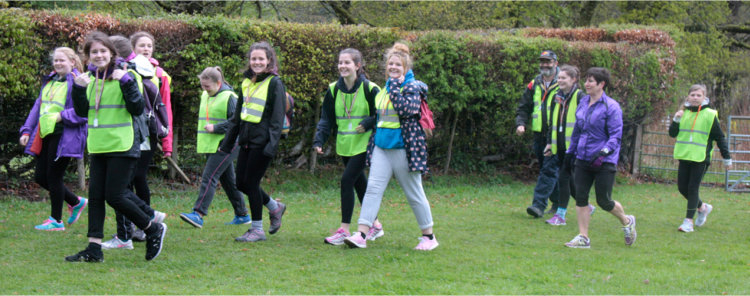 Young walkers in hi-viz vests